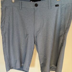 Travis Mathew golf shorts in Steele blue.